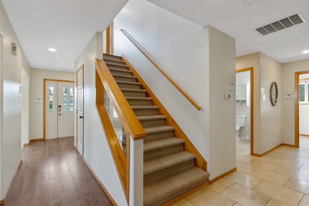 Head up these stairs and you will find an open landing leading to all five bedrooms!
