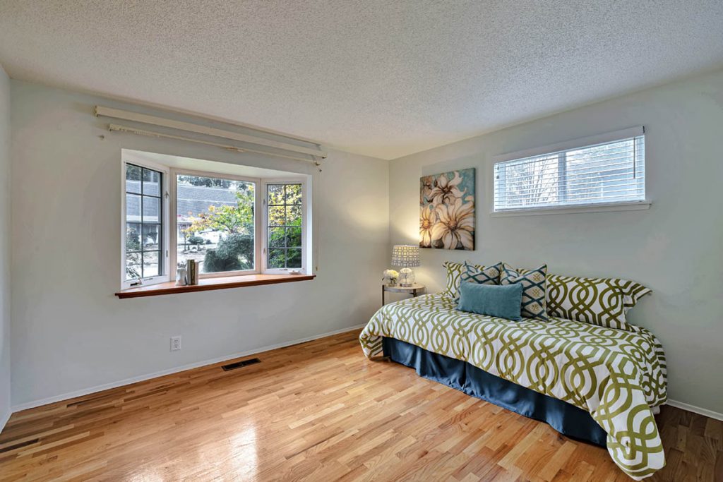 The 3rd bedroom is the largest of the 3 bedrooms on the main and features a bay window.