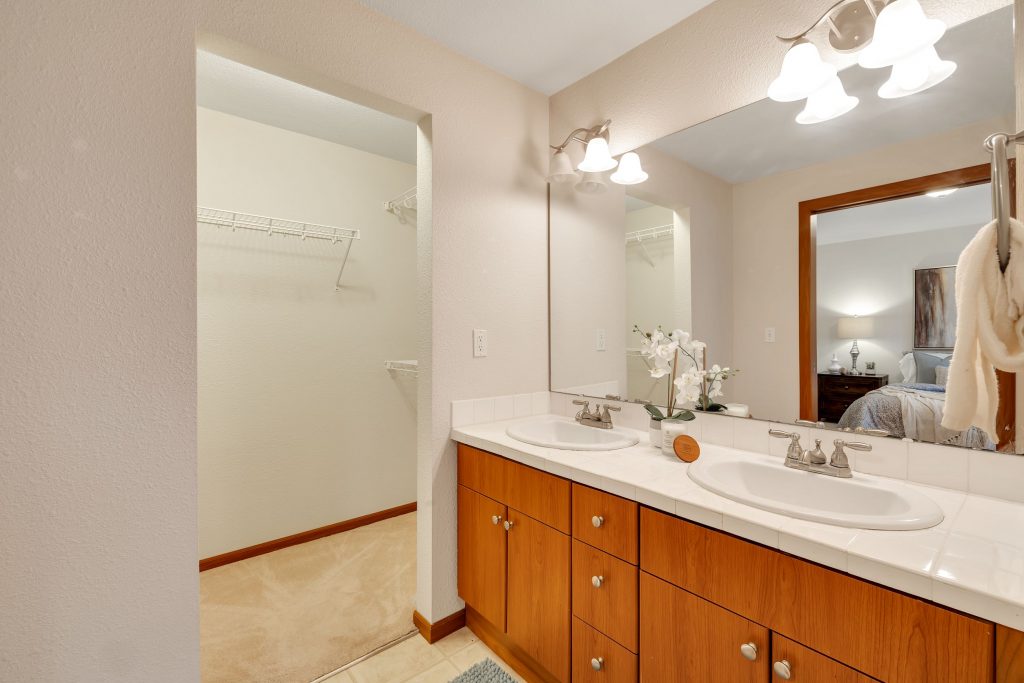 The primary full bathroom features dual vanities and a large walk-in closet.