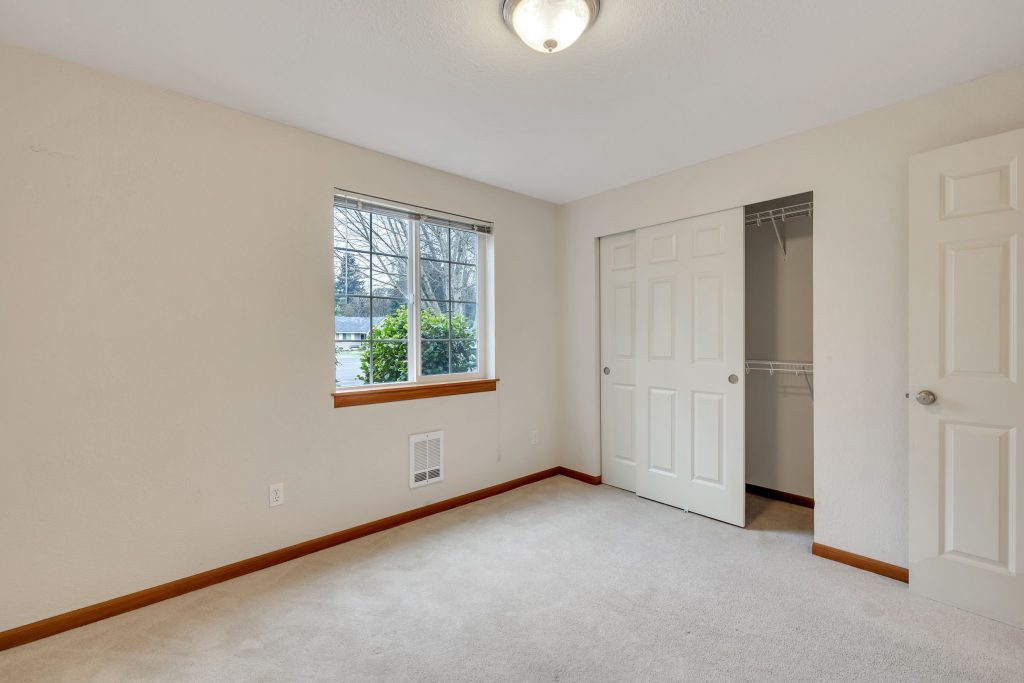 The second bedroom has a large window and a good-sized closet.