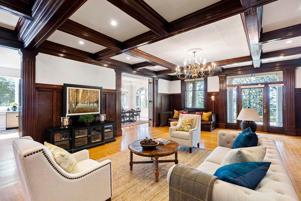 Gracious formal living room with original box beam ceiling