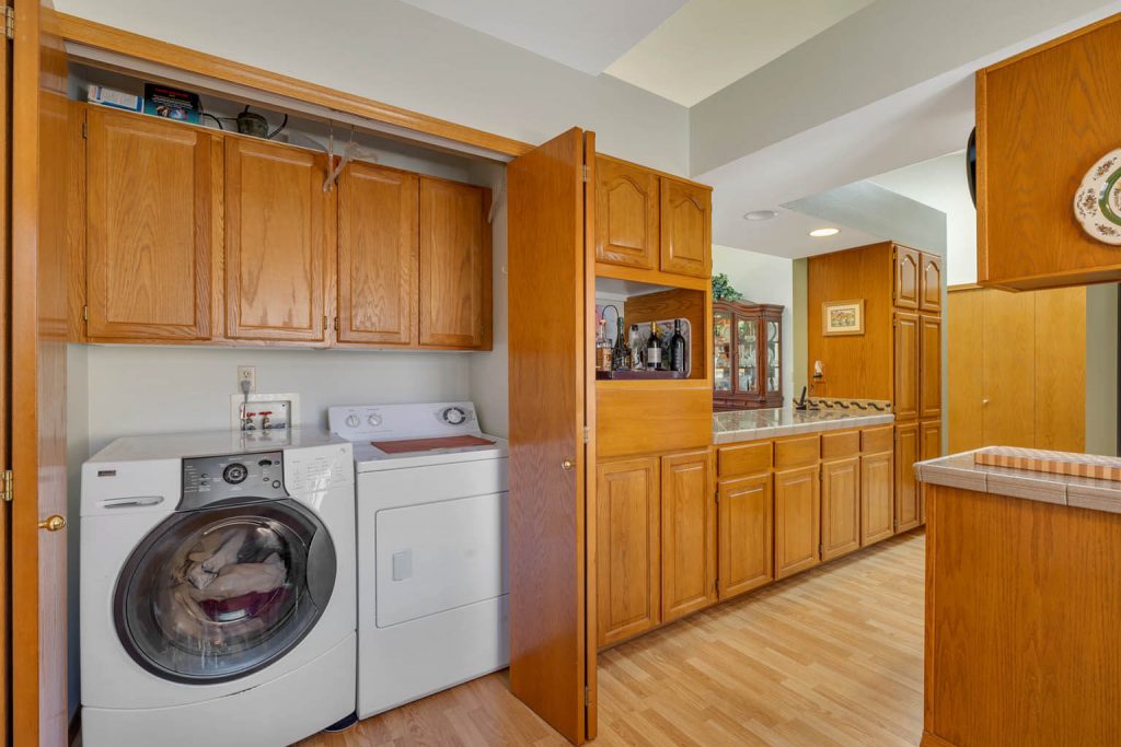 Laundry closet with cabinetry