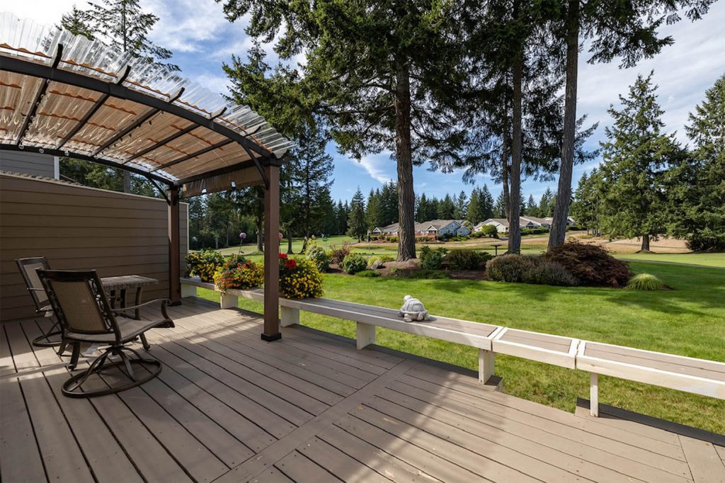 Check out the views from this fabulous deck! The opening in the bench is your gateway to the golf course.