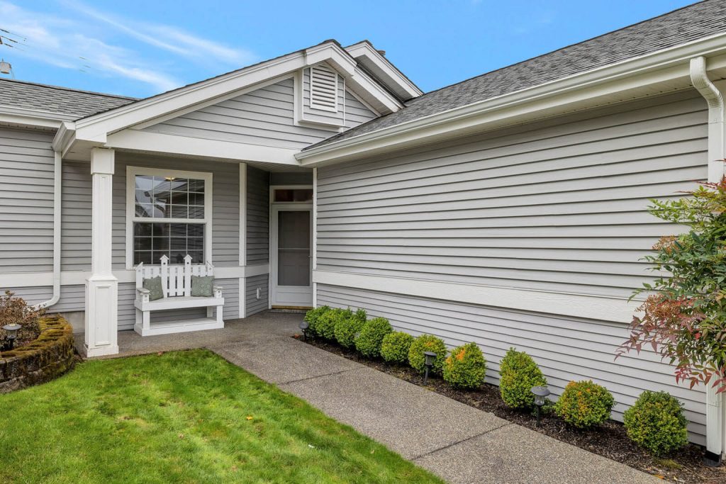 As you approach the one-step entrance, you will notice how well-maintained the exterior of these homes is.
