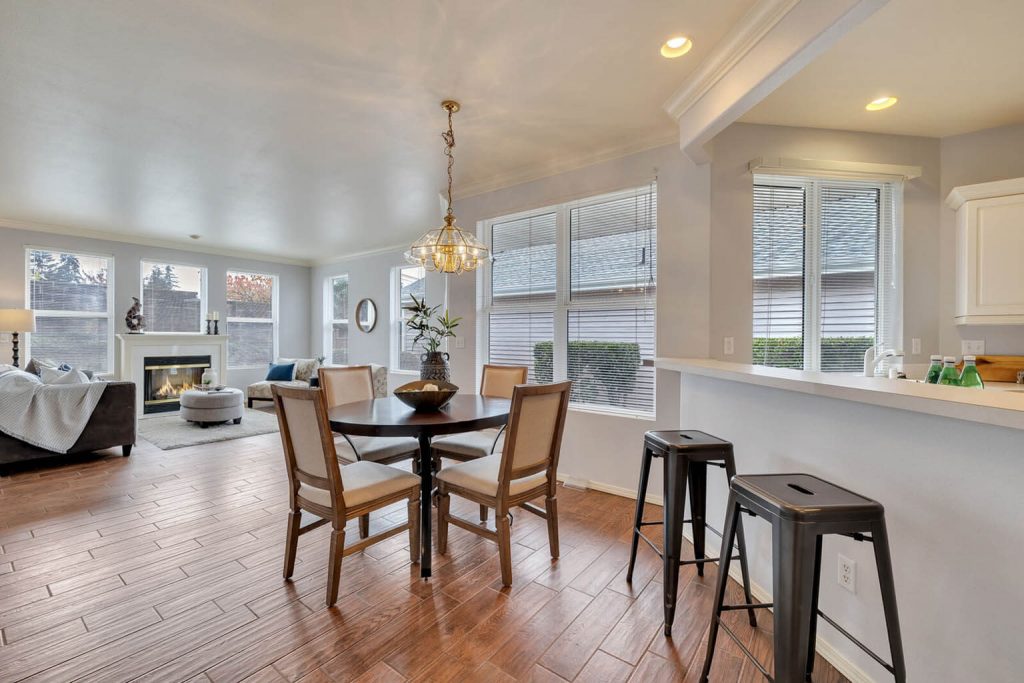 Come inside and take in the 9-foot ceilings, the ceramic tile flooring and the large picture windows giving this home a sense of spaciousness.