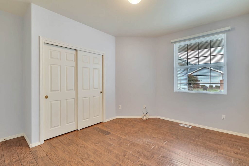 This oversized second bedroom is an ideal guest bedroom or office/den.