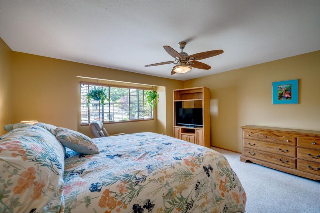 The primary bedroom is large enough to accommodate a king size bed and plenty of additional furniture.