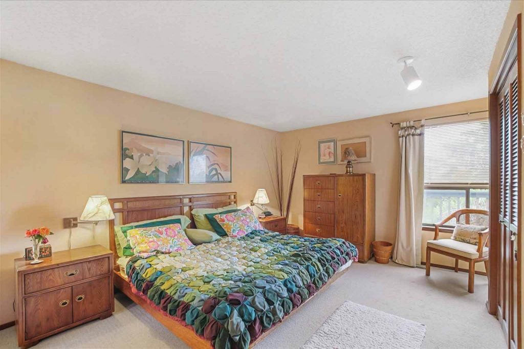 The primary bedroom features large walk-in closets and plenty of room for a king-sized bed and extra furniture. It also boasts views of the Olympics and Puget Sound.