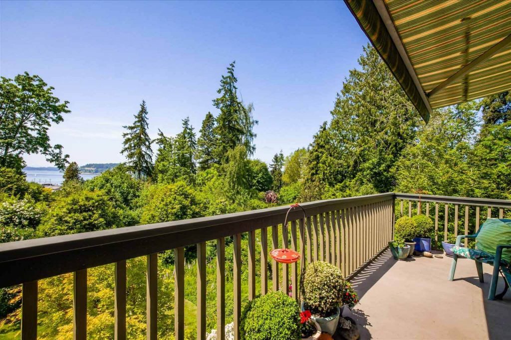 Just off the dining room you will find a sunny deck overlooking the lush 1.1 acre property and the Olympic mountains and Puget Sound.
